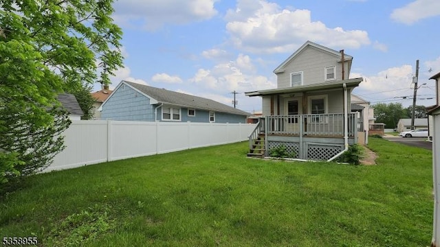 118 S 7th Ave, Manville Boro, NJ 08835 - rear view of house featuring a porch and stairway