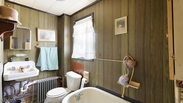 118 S 7th Ave, Manville Boro, NJ 08835 - full bathroom with radiator, toilet, a tub, and wood walls