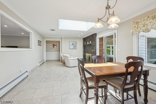 7 Dells Dr, Denville Twp, NJ 07834 - dining space featuring a baseboard heating unit, a skylight, crown molding, recessed lighting, and a wainscoted wall
