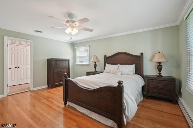 7 Dells Dr, Denville Twp, NJ 07834 - bedroom with a baseboard heating unit, light wood finished floors, ornamental molding, a ceiling fan, and baseboards