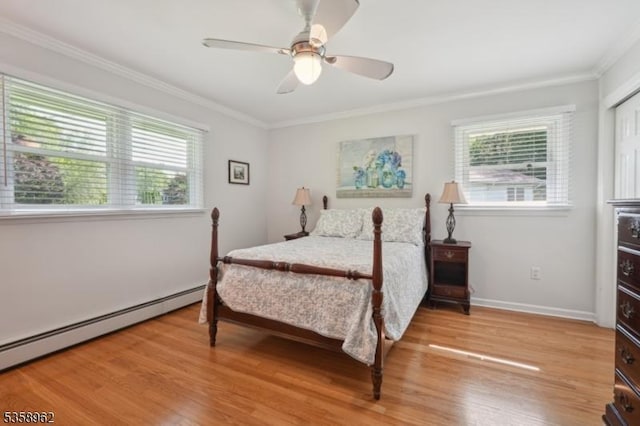 7 Dells Dr, Denville Twp, NJ 07834 - bedroom with crown molding, multiple windows, baseboard heating, light wood-style floors, and baseboards