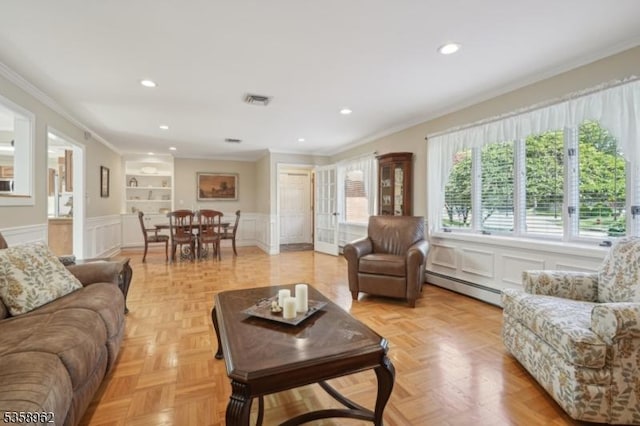 7 Dells Dr, Denville Twp, NJ 07834 - living area with a baseboard heating unit, crown molding, built in shelves, a decorative wall, and recessed lighting