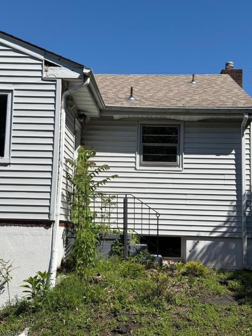733 US Highway 202, Bridgewater Twp, NJ 08807 - view of side of property featuring roof with shingles