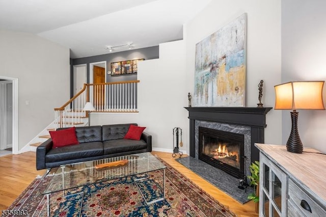 110 William St, Clark Twp, NJ 07066 - living area with wood finished floors, stairway, a high end fireplace, and baseboards