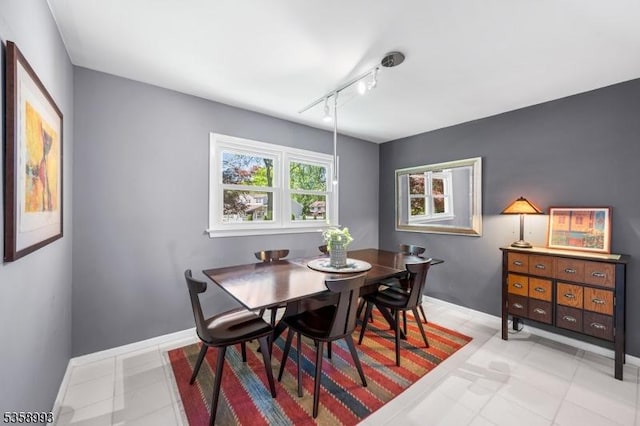 110 William St, Clark Twp, NJ 07066 - dining space with baseboards and rail lighting