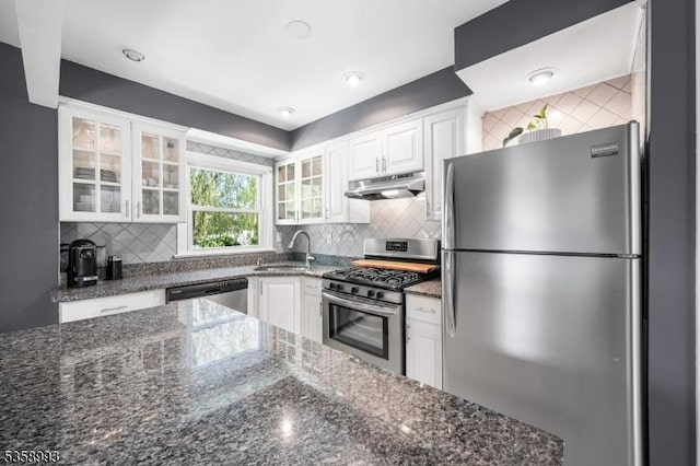 110 William St, Clark Twp, NJ 07066 - kitchen with stainless steel appliances, a sink, white cabinets, and tasteful backsplash