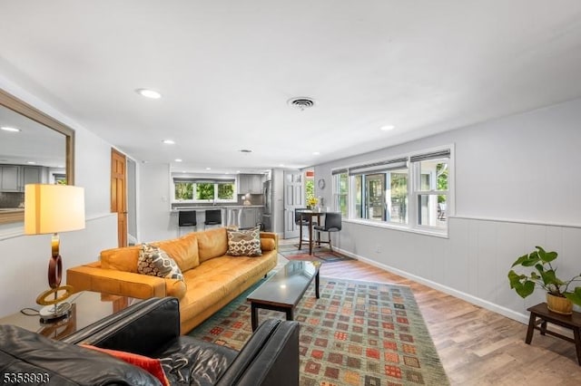 110 William St, Clark Twp, NJ 07066 - living area with light wood-type flooring, recessed lighting, and wainscoting