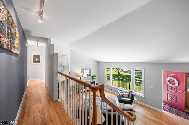 110 William St, Clark Twp, NJ 07066 - hallway with light wood-style flooring, baseboards, vaulted ceiling, and track lighting