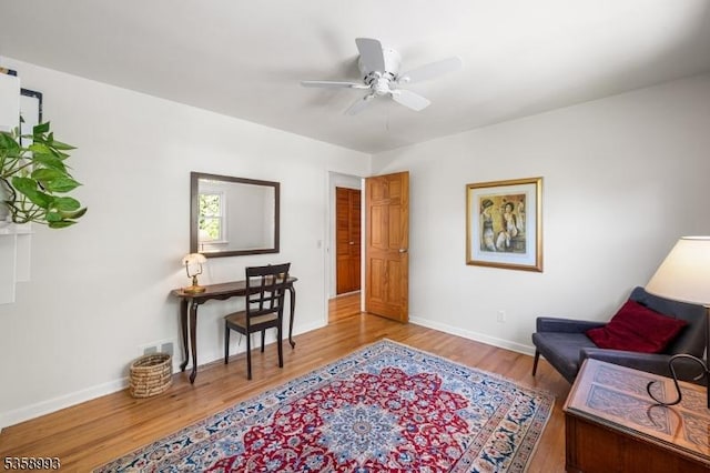 110 William St, Clark Twp, NJ 07066 - living area with wood finished floors, baseboards, and a ceiling fan