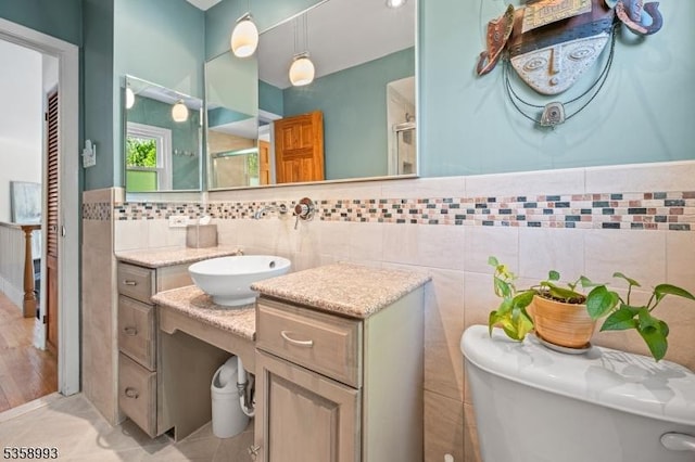 110 William St, Clark Twp, NJ 07066 - bathroom featuring tile walls, a shower stall, toilet, and vanity