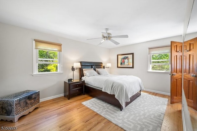 110 William St, Clark Twp, NJ 07066 - bedroom featuring multiple windows, baseboards, light wood finished floors, and ceiling fan