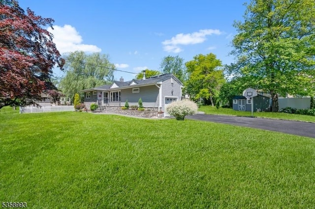 110 William St, Clark Twp, NJ 07066 - back of house with driveway and a chimney