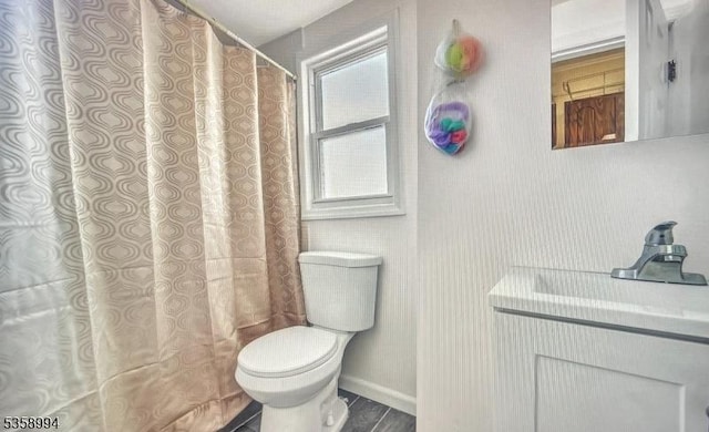 61 Thornall St, Carteret Boro, NJ 07008 - bathroom with toilet, vanity, a shower with shower curtain, and baseboards