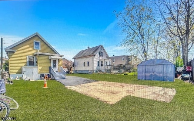 61 Thornall St, Carteret Boro, NJ 07008 - rear view of house featuring a lawn
