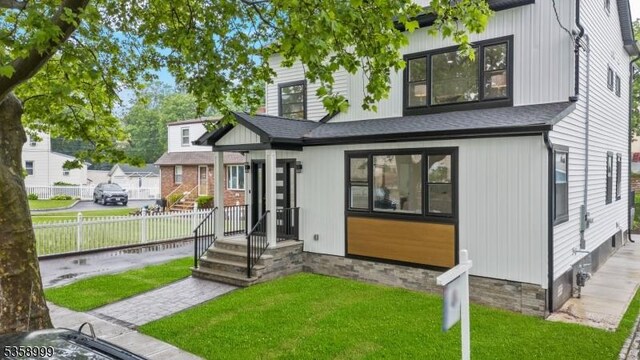 22 Race St, Nutley Twp, NJ 07110 - rear view of property with roof with shingles