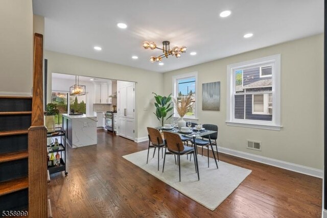 22 Race St, Nutley Twp, NJ 07110 - dining area featuring a chandelier, baseboards, dark wood finished floors, and recessed lighting
