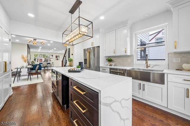 22 Race St, Nutley Twp, NJ 07110 - kitchen with stainless steel appliances, a chandelier, a sink, recessed lighting, and dark wood-style flooring