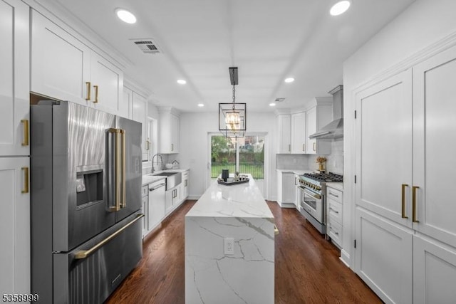 22 Race St, Nutley Twp, NJ 07110 - kitchen featuring premium appliances, wall chimney exhaust hood, a kitchen island, recessed lighting, and dark wood-type flooring