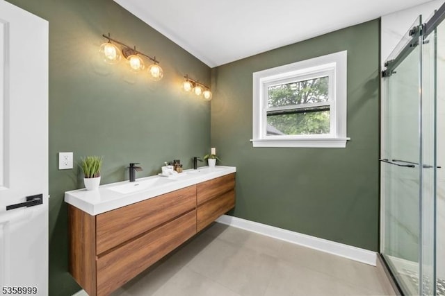 22 Race St, Nutley Twp, NJ 07110 - bathroom featuring a shower stall, double vanity, and baseboards