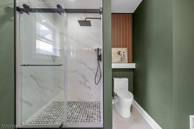 22 Race St, Nutley Twp, NJ 07110 - bathroom featuring a marble finish shower, toilet, and tile patterned floors