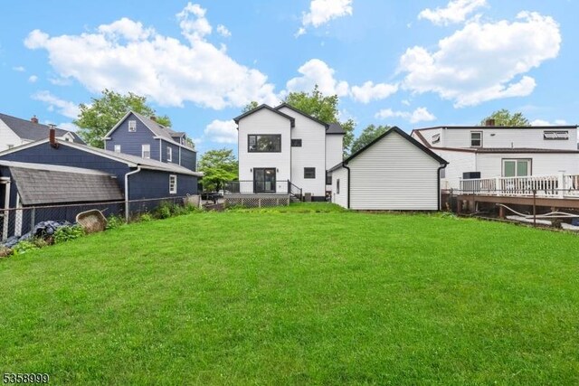 22 Race St, Nutley Twp, NJ 07110 - back of property with a wooden deck