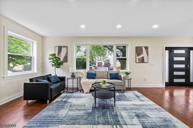 22 Race St, Nutley Twp, NJ 07110 - living area with wood finished floors, baseboards, and recessed lighting