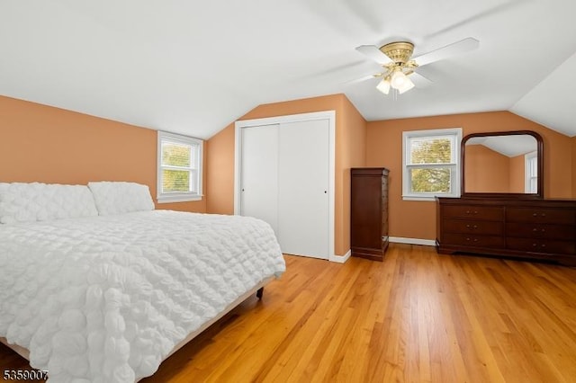 580 Mountainview Dr, North Plainfield Boro, NJ 07063 - bedroom featuring a closet, light wood-style floors, multiple windows, lofted ceiling, and ceiling fan