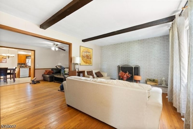 580 Mountainview Dr, North Plainfield Boro, NJ 07063 - living area with a fireplace, light wood finished floors, beam ceiling, and a chandelier