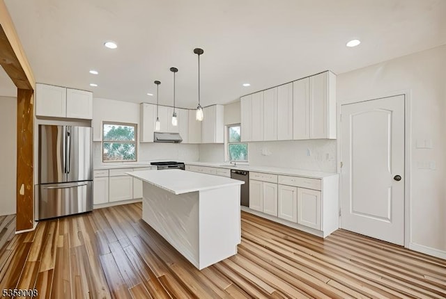 1899 Washington Valley Rd, Bridgewater Twp, NJ 08836 - kitchen featuring freestanding refrigerator, ventilation hood, light wood-style flooring, dishwasher, and healthy amount of natural light
