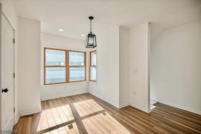 1899 Washington Valley Rd, Bridgewater Twp, NJ 08836 - unfurnished dining area with wood finished floors, baseboards, and recessed lighting