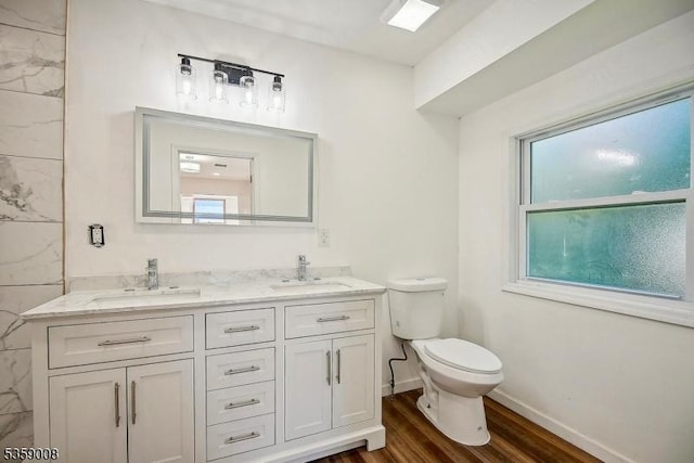 1899 Washington Valley Rd, Bridgewater Twp, NJ 08836 - full bathroom featuring toilet, double vanity, wood finished floors, and baseboards