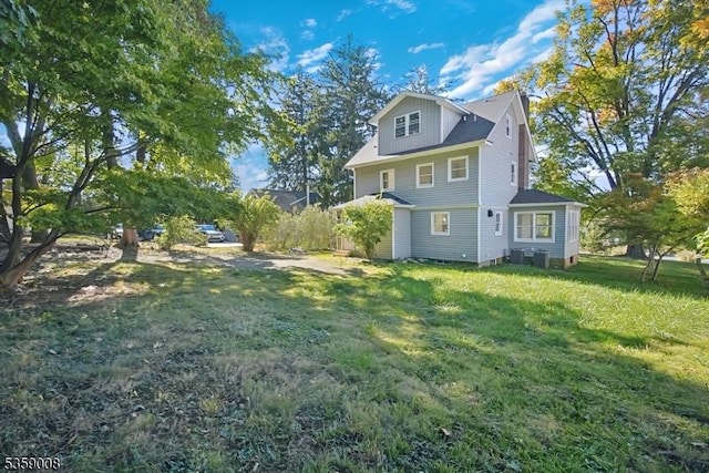 1899 Washington Valley Rd, Bridgewater Twp, NJ 08836 - back of house featuring a lawn and cooling unit