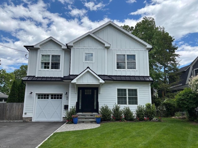 84 Elmwood Ave, Chatham Boro, NJ 07928 - view of front facade with an attached garage, a standing seam roof, asphalt driveway, and board and batten siding
