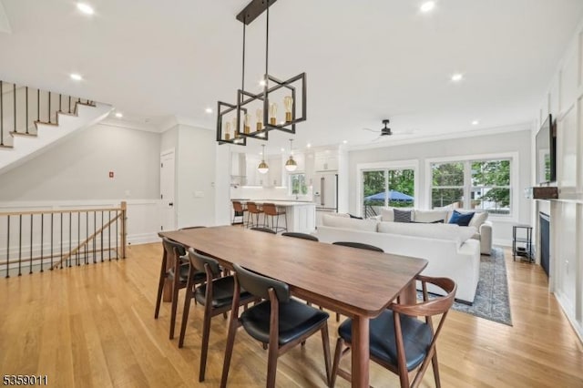 84 Elmwood Ave, Chatham Boro, NJ 07928 - dining area featuring crown molding, ceiling fan, light wood-style floors, recessed lighting, and stairway