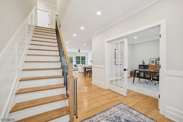 84 Elmwood Ave, Chatham Boro, NJ 07928 - staircase featuring french doors, crown molding, wood finished floors, and recessed lighting