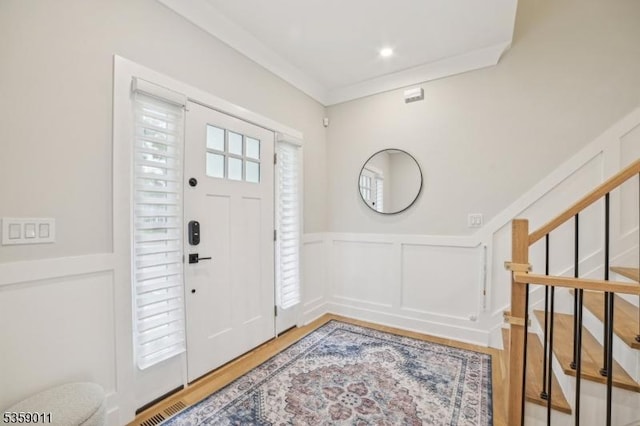 84 Elmwood Ave, Chatham Boro, NJ 07928 - foyer featuring a decorative wall, wood finished floors, wainscoting, and stairway