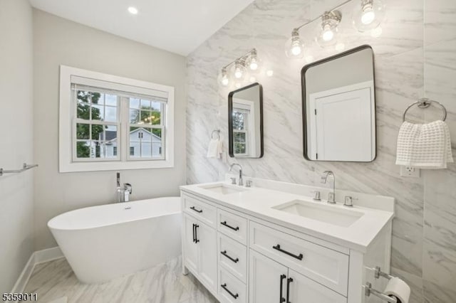84 Elmwood Ave, Chatham Boro, NJ 07928 - bathroom featuring double vanity, a freestanding tub, marble finish floors, and baseboards