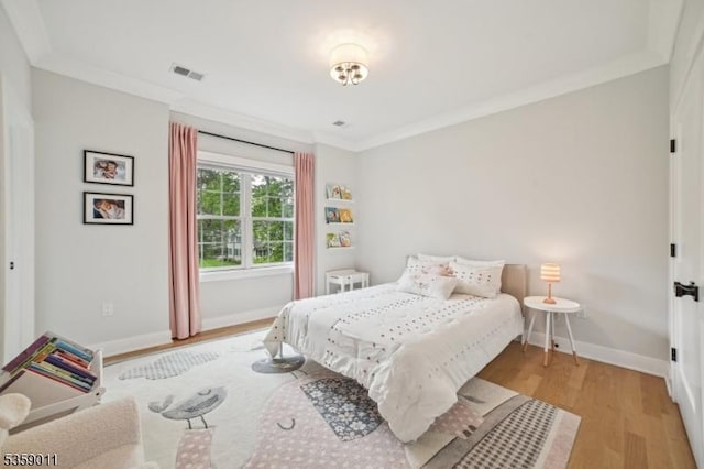 84 Elmwood Ave, Chatham Boro, NJ 07928 - bedroom with wood finished floors, baseboards, and crown molding