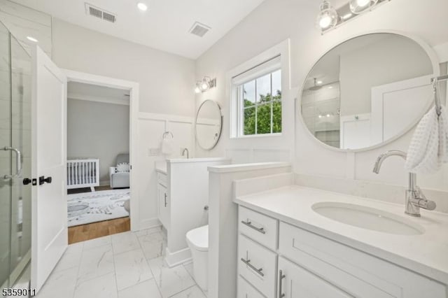 84 Elmwood Ave, Chatham Boro, NJ 07928 - ensuite bathroom featuring marble look tiles, a shower stall, vanity, and toilet
