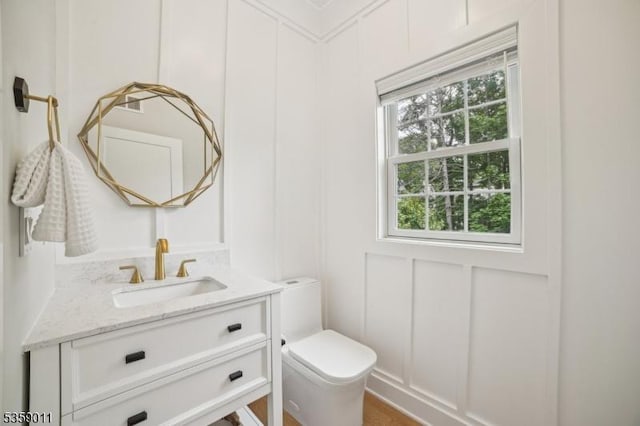 84 Elmwood Ave, Chatham Boro, NJ 07928 - bathroom with a decorative wall, toilet, and vanity