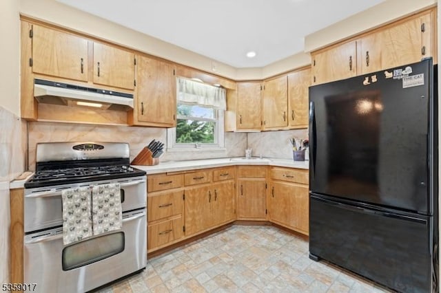 37 Furber Ave, Linden City, NJ 07036 - kitchen featuring freestanding refrigerator, range with two ovens, under cabinet range hood, light countertops, and backsplash