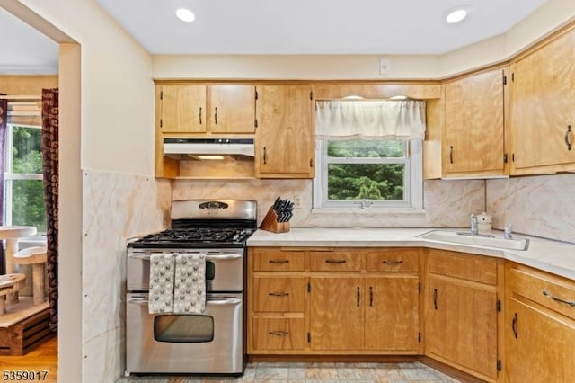 37 Furber Ave, Linden City, NJ 07036 - kitchen with range with two ovens, under cabinet range hood, light countertops, tasteful backsplash, and recessed lighting