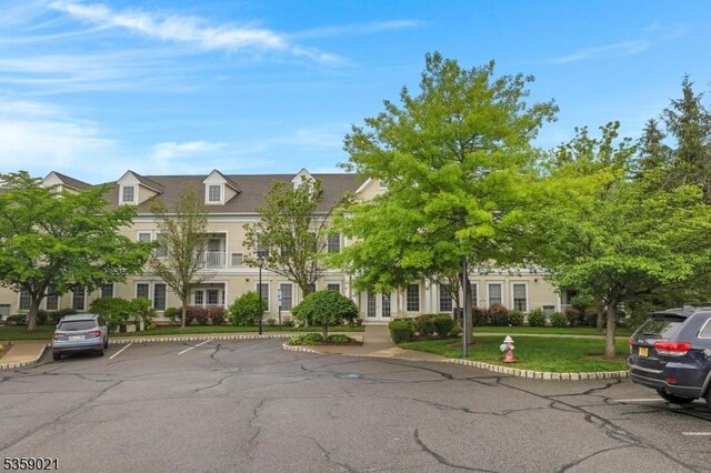 7013 Brookfield Glen Dr, White Twp, NJ 07823 - view of front of property featuring french doors, uncovered parking, and a front lawn
