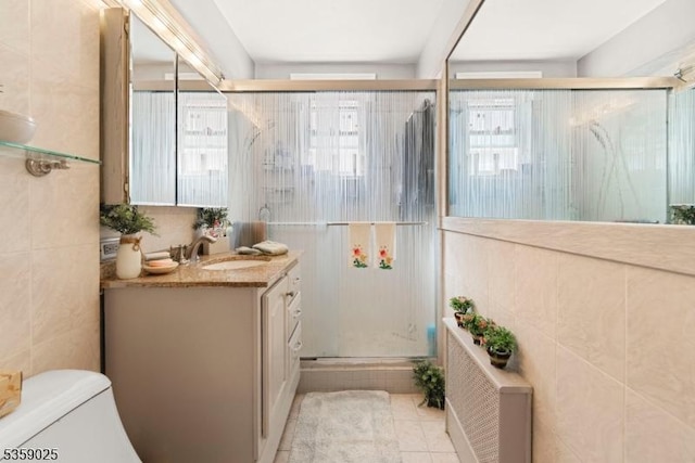 263 Morningside Ave, Cliffside Park Boro, NJ 07010 - full bath with tile walls, a shower stall, tile patterned floors, vanity, and toilet