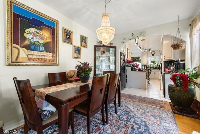 263 Morningside Ave, Cliffside Park Boro, NJ 07010 - dining area featuring arched walkways and a chandelier