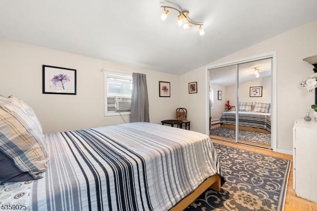263 Morningside Ave, Cliffside Park Boro, NJ 07010 - bedroom with lofted ceiling, light wood-style flooring, a baseboard radiator, a closet, and cooling unit