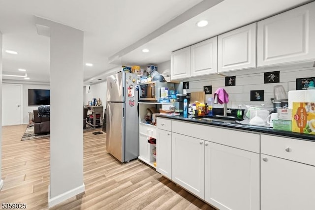 263 Morningside Ave, Cliffside Park Boro, NJ 07010 - kitchen featuring freestanding refrigerator, dark countertops, light wood-style floors, white cabinets, and recessed lighting