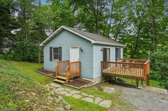 2 Beach Plz, Hardyston Twp, NJ 07460 - back of house with a deck, a shingled roof, and view of wooded area