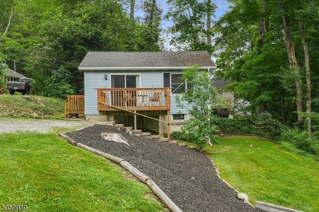 2 Beach Plz, Hardyston Twp, NJ 07460 - view of front facade with a wooden deck, a front yard, and a shingled roof