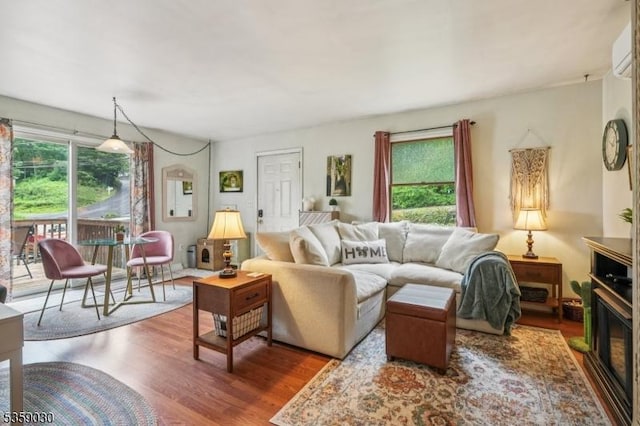 2 Beach Plz, Hardyston Twp, NJ 07460 - living room featuring wood finished floors, plenty of natural light, and a wall mounted AC